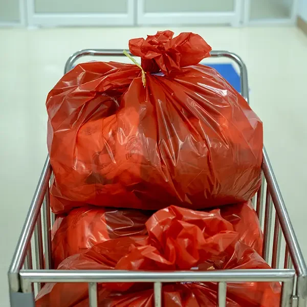 hazardous medical waste trash bags in a cart